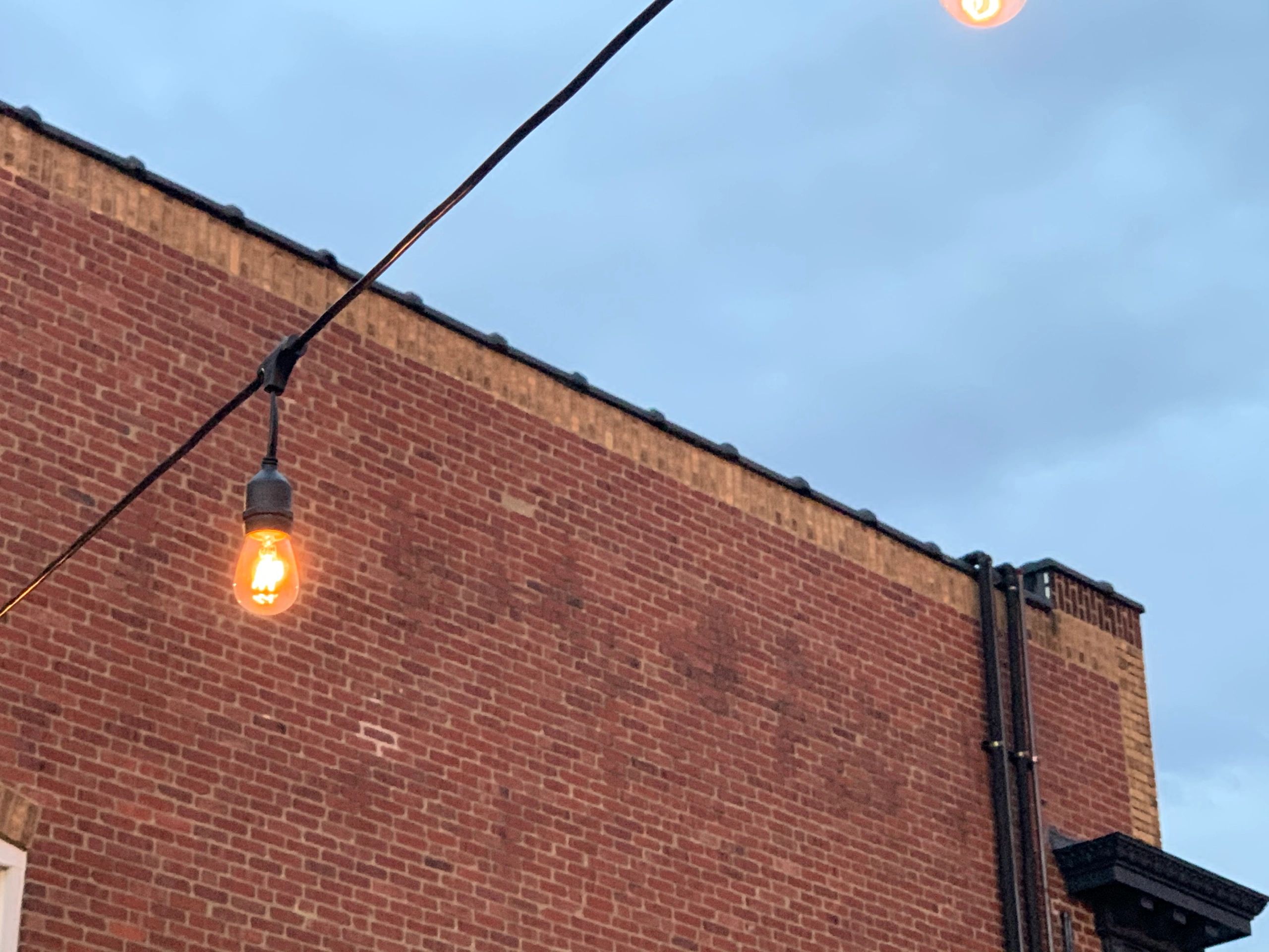 Outdoor patio lighting in landscaped courtyard