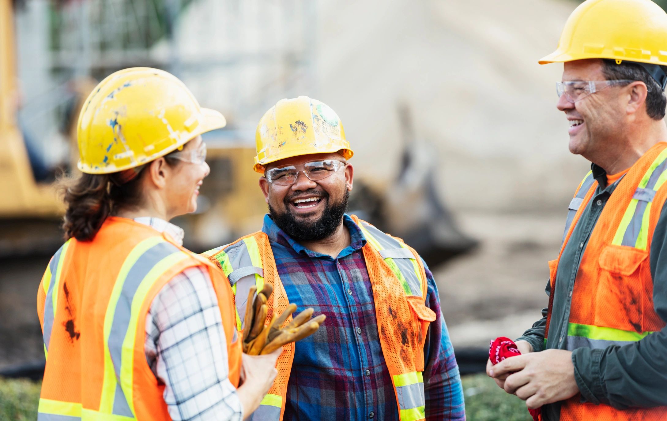 Construction team members discussing work on site