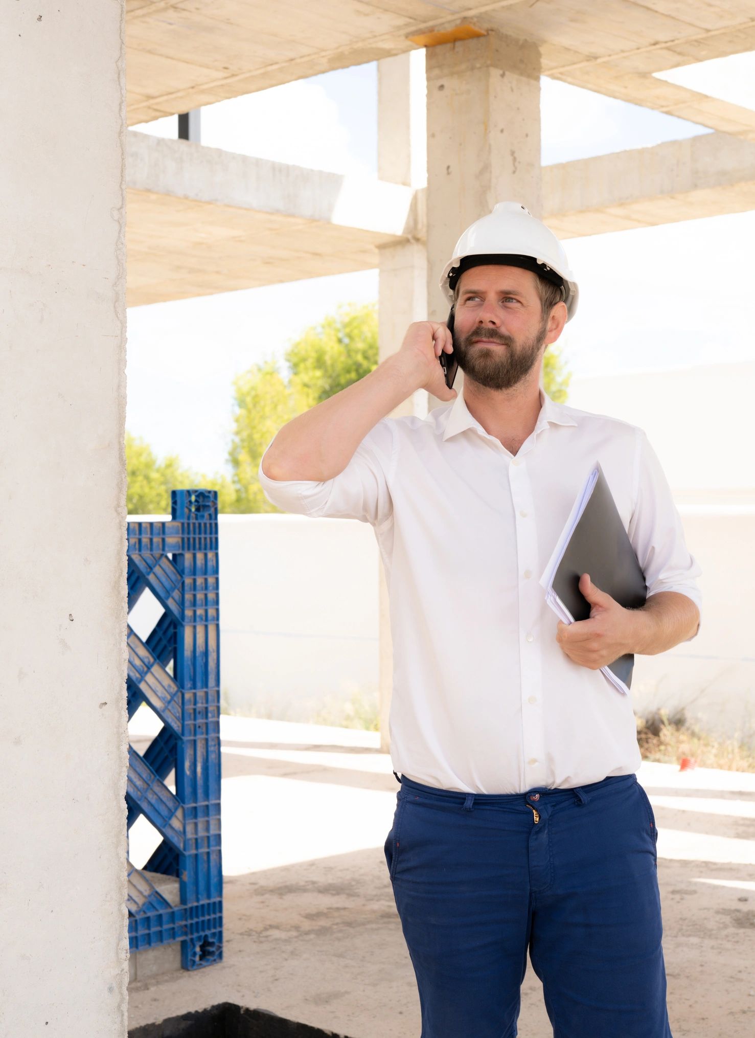 Construction professional holding plans